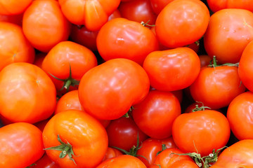 Ripe red tomatoes background. organic vegetables on the shelves of the hypermarket