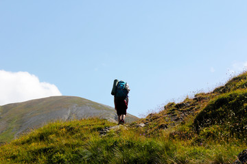 hiker walking in mountain track 