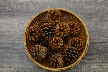 Pinecones in bamboo basket