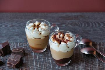 two coffee cream with chocolate in glass cups