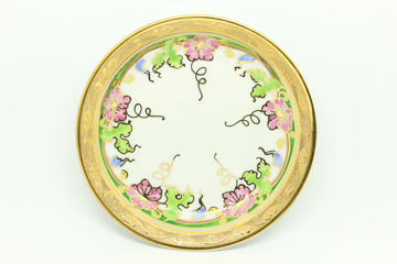 Benjarong Plate on white background, souvenir from Thailand.