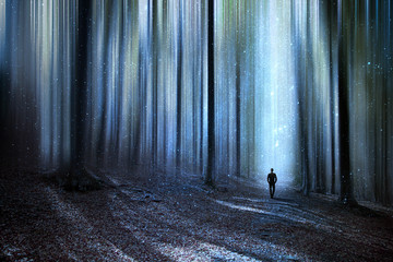 Man walking through a surreal forest