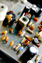 Dusty and dirty vintage electronics background with resisters, capacitors,diodes and other components