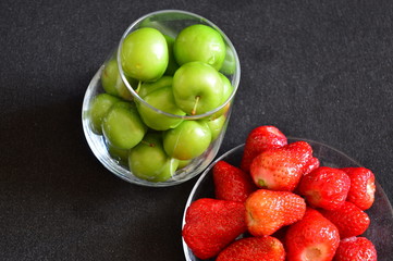 strawberries and cherry plum in a glass