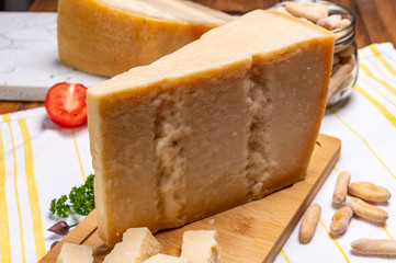 Big wedges of parmigiano-reggiano parmesan hard Italian cheese made from cow milk or Grana Padano