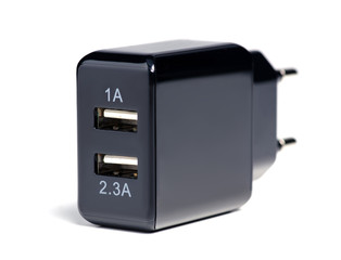 Black USB charger on white background isolation