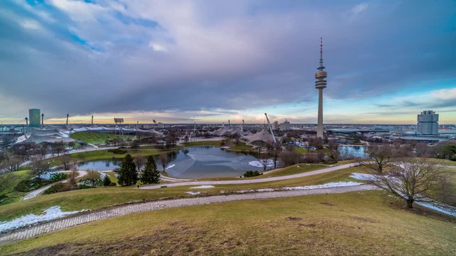 Munich skyline aerial view of olympic tower from top time lapse from day to night.