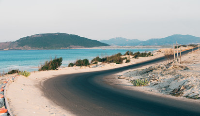 view of the beach and road