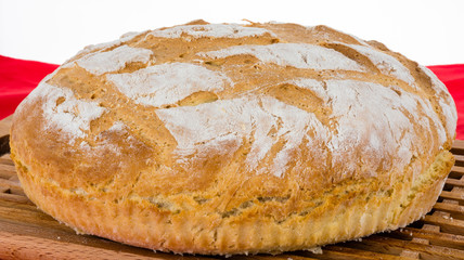 Freshly baked homemade bread on bread board.