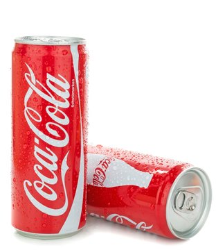 NIEDERSACHSEN, GERMANY AUGUST 10, 2014: Thin style 0,33 liter cans of coca cola soft drink with water droplets on a white background