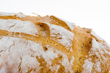 Freshly baked homemade bread on bread board.