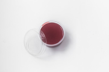 Close up of medical experiments. transparent jar, three pockets with reagents, medical gloves on isolated light background. Experiments for kids. Selective focus