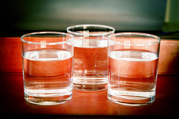 Glass glasses filled with water on a table