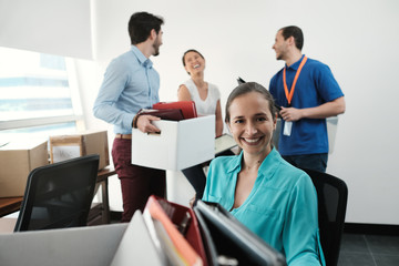 Business People Moving Into New Office Unpacking Boxes