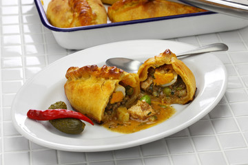 homemade saltena, empanada with a juicy filling, Bolivian breakfast