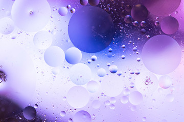oil drops on water with coloured background 