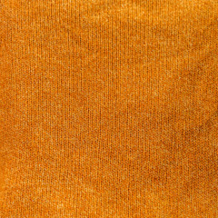 knitted orange textured background close up