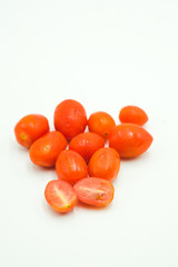 Tomato cherry shot on a white isolated background.