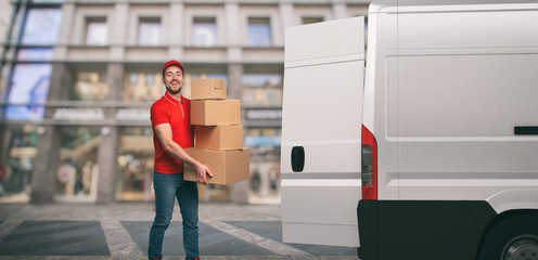 Red courier outside carries parcels with a withe van for deliveries of shipments.