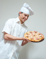 portrait cook with pizza on a light background