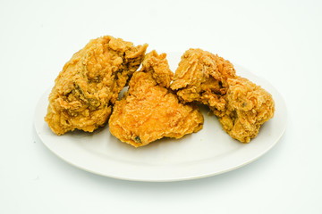 Deep fried chicken shot on a white isolated background.