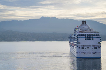 Modern white Princess Cruises cruiseship or cruise ship liner Island Princess arrival into port of...