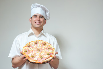portrait cook with pizza on a light background