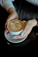 Coffee drink table hands skin cappuccino latte black background breakfast coffee time break cafe...