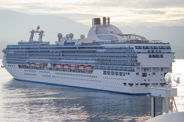 Modern white Princess Cruises cruiseship or cruise ship liner Island Princess arrival into port of...