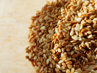 Roasted peanuts in a glass plate close-up. Culinary background, copyspace on the right.