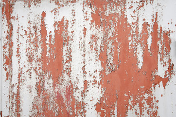 Old cracked paint on the steel door. Texture, pattern background. The door cracked with paint, paint behind the iron. white color, eventually peeling off