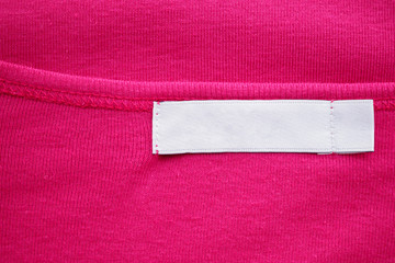 Blank white clothes tag label on new shirt