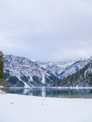 winter on lake plansee austria foggy mountains snow lake