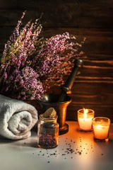 Spa still life. Body care products, towel, candles and lavender, aromatherapy. Copy space