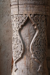 Traditional uzbek ornament on the column. Wood carving