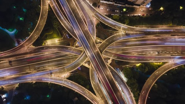 Hyper Lapse Rising Drone Shot View Reveals Spectacular Elevated Highway And Convergence Of Roads, Bridges, Viaducts In Shanghai Night, Transportation And Infrastructure Development In China Timelapse.