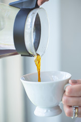 pouring water into glass