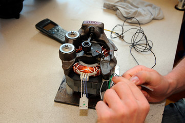 Engineer working on electric motor