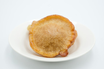 Pinjaram, penyaram of penjaram, a traditional bajau or suluk or sea bajau tribe traditional cuisines, shot on a white isolated background.