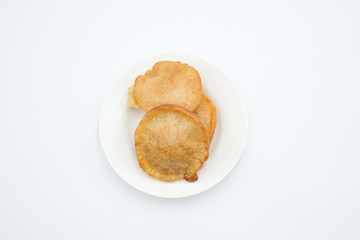 Pinjaram, penyaram of penjaram, a traditional bajau or suluk or sea bajau tribe traditional cuisines, shot on a white isolated background.