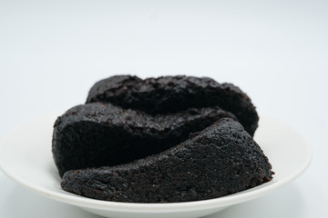 chocolate moist cake shot on a white isolated background.