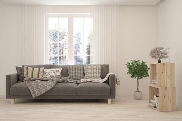 White living room with sofa and winter landscape in window. Scandinavian interior design. 3D illustration