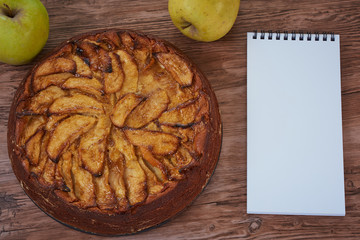 Homemade apple pie with a wooden base