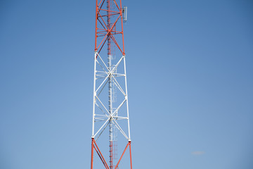 Telecommunication the cell phone tower on blue sky background. Mast communication technology...