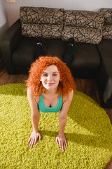 Woman make sport push ups at home