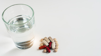 Multi pill vitamins and supplements for improving health and cure sickness flu, fever and coronavirus. A smartwatch application as a reminder to take drugs and drink water on right time