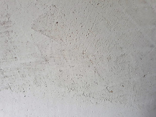 Internal spackling. The texture of the wall, putty on a rough starting mixture. Stains and scratches on the wall. 