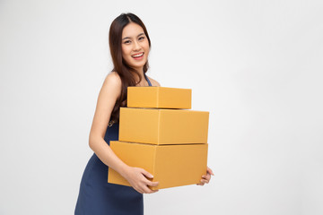 Happy Asian woman holding package parcel box isolated on white background, Delivery courier and shipment service concept