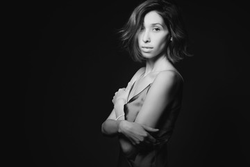 Obraz premium Portrait of a beautiful, sexy girl. Black and white art photo. The concept of beauty and youth