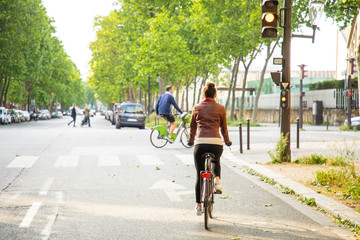 Naklejka premium young woman riding a bike